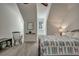 Comfortable bedroom with wood bed frame, blue quilt, rocking chair, and a ceiling fan offering a serene and stylish retreat at 2028 Ironstone Aly, Charleston, SC 29407