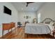 Spacious bedroom with hardwood floors, shutters, and ceiling fan at 2028 Ironstone Aly, Charleston, SC 29407
