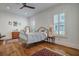 Sun-filled bedroom with hardwood floors, a ceiling fan, and charming decor at 2028 Ironstone Aly, Charleston, SC 29407