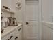 Bright butler's pantry with white cabinetry, quartz countertops, and stainless steel coffee-making appliances at 2028 Ironstone Aly, Charleston, SC 29407