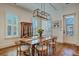 Dining room with wooden table, seating, and shuttered windows at 2028 Ironstone Aly, Charleston, SC 29407