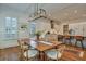 Dining area with wooden table, seating, and open view to kitchen at 2028 Ironstone Aly, Charleston, SC 29407