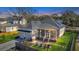 Charming home featuring a two-car garage, inviting front porch, and manicured front yard at 2028 Ironstone Aly, Charleston, SC 29407