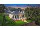 Beautiful two-story home with a classic white exterior, a welcoming front porch, and well-kept lawn at 2028 Ironstone Aly, Charleston, SC 29407