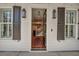 Inviting entryway showcasing hardwood floors, stairs, and views into the dining and kitchen areas at 2028 Ironstone Aly, Charleston, SC 29407