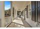 Inviting porch with rocking chairs, black shutters, and bright white columns at 2028 Ironstone Aly, Charleston, SC 29407