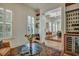 Stylish living area with decorative rug, wine storage, and ample shelving at 2028 Ironstone Aly, Charleston, SC 29407