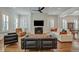 Bright living room featuring stylish seating, a fireplace, and hardwood floors at 2028 Ironstone Aly, Charleston, SC 29407