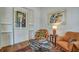 Stylish living area with two chairs, decorative rug, and ample artwork at 2028 Ironstone Aly, Charleston, SC 29407