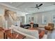 Open-concept living room showcasing hardwood floors and a neutral color palette at 2028 Ironstone Aly, Charleston, SC 29407