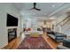 Bright and airy living room with fireplace and view into kitchen area at 2028 Ironstone Aly, Charleston, SC 29407