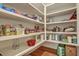 Walk-in pantry featuring custom shelving and abundant space for food and storage at 2028 Ironstone Aly, Charleston, SC 29407