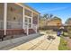 Paver patio with table and grill next to screened in porch at 2028 Ironstone Aly, Charleston, SC 29407