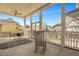 Covered patio has rocking chair, outdoor table and chairs, and nice neighborhood views creating a great space for outdoor living at 2028 Ironstone Aly, Charleston, SC 29407