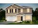 Charming two-story home featuring a covered porch, a two-car garage, and manicured landscaping at 215 W Bradford Pointe Drive Dr, Summerville, SC 29483