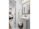 Bathroom featuring a pedestal sink, a decorative mirror, and tile flooring with accent rugs at 221 Waning Way, Charleston, SC 29492