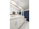 Bathroom with double sink vanity, modern fixtures, large mirror, and navy shower curtain at 221 Waning Way, Charleston, SC 29492