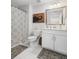 Clean, white bathroom featuring tiled floor, single vanity and patterned shower curtain at 221 Waning Way, Charleston, SC 29492