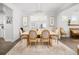Bright dining room featuring a wooden table with upholstered chairs and a crystal chandelier at 221 Waning Way, Charleston, SC 29492