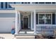 Inviting front porch with white columns, a 