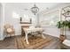 Bright home office featuring stylish decor, a white desk, and a modern chandelier at 221 Waning Way, Charleston, SC 29492