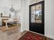 Inviting entry way with a view into the home office with desk, rug, and decor at 221 Waning Way, Charleston, SC 29492