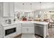 Bright, open kitchen featuring white countertops, stainless steel appliances, and center island at 221 Waning Way, Charleston, SC 29492
