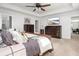 This stylish main bedroom with a TV and tasteful decor offers comfort and relaxation at 221 Waning Way, Charleston, SC 29492