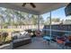 Enjoy the outdoors on this screened porch, featuring comfortable seating and backyard views at 221 Waning Way, Charleston, SC 29492