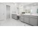 Well-lit bathroom featuring double sinks, quartz countertops, and vanity space at 2305 Sturgeon, Johns Island, SC 29455