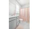 Well-lit bathroom featuring modern fixtures, a stylish vanity, and a shower with a charming polka-dot curtain at 2305 Sturgeon, Johns Island, SC 29455