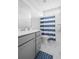 Bathroom showcasing a single vanity, toilet, and shower-tub combination with a blue and white striped shower curtain at 2305 Sturgeon, Johns Island, SC 29455