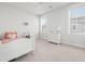 Charming bedroom with a white bed frame, soft pink accents, and natural light creating a cozy atmosphere at 2305 Sturgeon, Johns Island, SC 29455