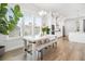 Bright dining area features a wooden table, bench seating, and lots of natural light at 2305 Sturgeon, Johns Island, SC 29455