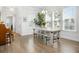 Elegant dining room with modern table and chairs, and plenty of natural light at 2305 Sturgeon, Johns Island, SC 29455