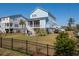 Beautiful blue two-story home with screened porch, fenced backyard, and convenient parking at 2305 Sturgeon, Johns Island, SC 29455