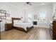 Spacious main bedroom with decorative fireplace, hardwood floors, and recessed lighting at 2305 Sturgeon, Johns Island, SC 29455