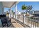 Inviting porch with rocking chairs and a neighborhood view at 2305 Sturgeon, Johns Island, SC 29455