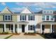 Charming multi-colored townhomes featuring black shutters and covered front porches at 237 Abercom Place Dr, Moncks Corner, SC 29461