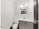 Bathroom features a toilet, mirror, vanity, and framed mirror with vanity lighting at 2461 Fulford Ct, Mount Pleasant, SC 29466