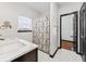 Bathroom with marble vanity, white tile floors, and shower at 2461 Fulford Ct, Mount Pleasant, SC 29466