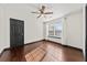 Well lit bedroom with hardwood floors, black trim, ceiling fan, and a window at 2461 Fulford Ct, Mount Pleasant, SC 29466