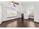 Bright bedroom featuring a ceiling fan, hardwood floors, and a large window providing natural light at 2461 Fulford Ct, Mount Pleasant, SC 29466