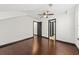 Spacious bedroom featuring hardwood floors, a ceiling fan, and contrasting trim at 2461 Fulford Ct, Mount Pleasant, SC 29466