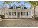 Charming two-story home with a welcoming front porch, white pillars and classic black shutters at 2461 Fulford Ct, Mount Pleasant, SC 29466