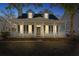 Charming two-story home with a welcoming front porch, white pillars and classic black shutters at 2461 Fulford Ct, Mount Pleasant, SC 29466