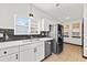 Well-lit kitchen featuring stainless steel appliances and a double sink beneath a window at 2461 Fulford Ct, Mount Pleasant, SC 29466