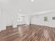 Open-concept living room with wood floors, mini-split system and bright natural light at 2461 Fulford Ct, Mount Pleasant, SC 29466