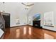 Bright living room featuring hardwood floors, fireplace, tall ceilings, and lots of natural light at 2461 Fulford Ct, Mount Pleasant, SC 29466