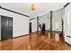 Bright living room with hardwood floors, stylish light fixture and multiple doorways at 2461 Fulford Ct, Mount Pleasant, SC 29466